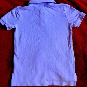 100% cotton
Machine wash
Size 7 
collar
Two button
Short sleeves
Tennis tail